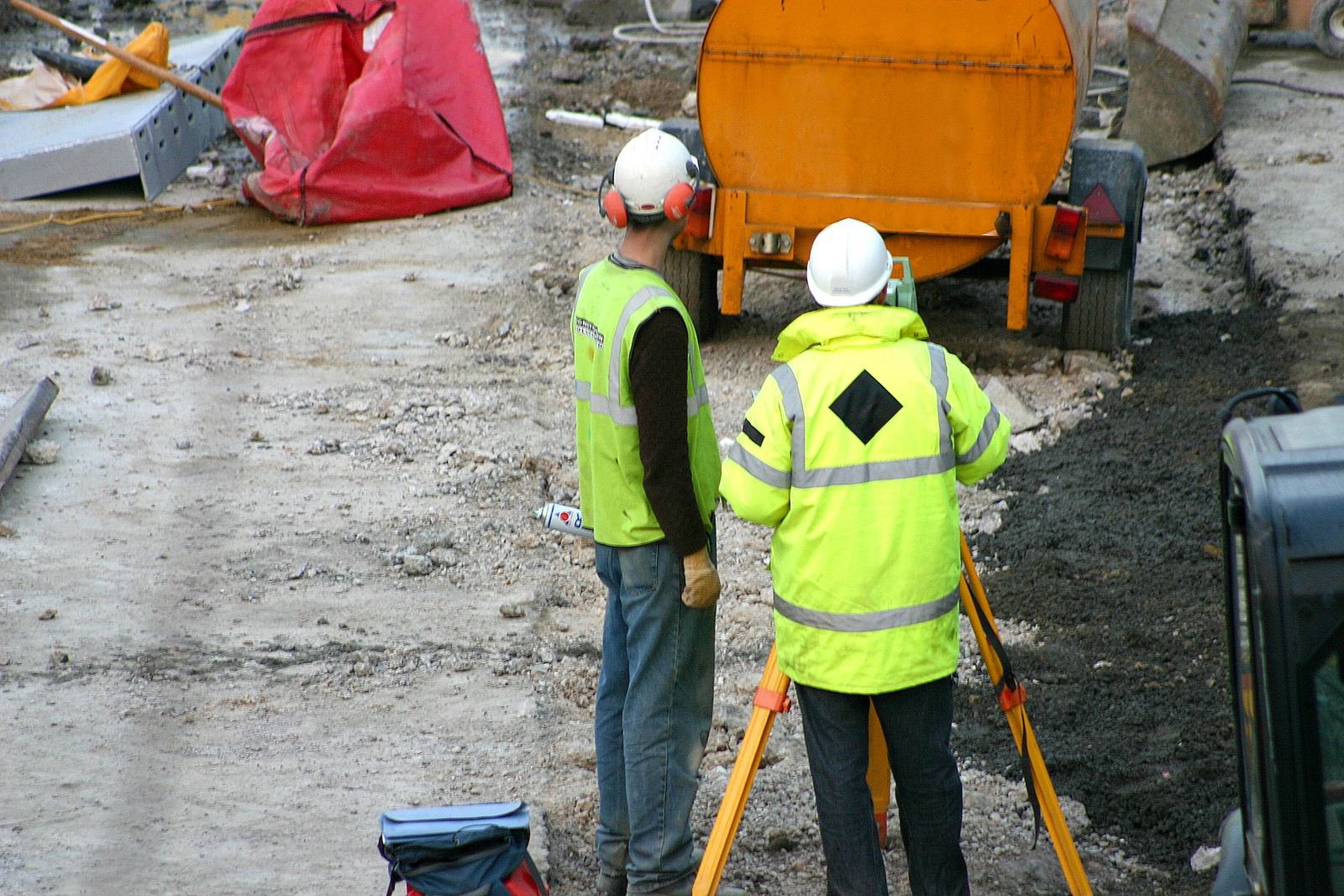 Survey crew on an urban commercial construction site